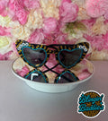 Custom GAMEDAY rhinestone heart sunglasses with teal and gold bling and DUUUVAL letter beads on floral backdrop
